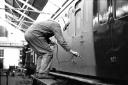 In 1964 the principal employer in Eastleigh was the Eastleigh Railway Works which was due to undergo a £1¼  million modernisation plan. This picture shows a painter at work using an airless spray gun. February 1965. THE SOUTHERN DAILY