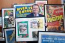 Karl Bennett of Bloomfield Auctions with some of the vintage film posters (PressEye/PA)