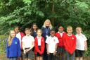 Headteacher Marcella Dobson with pupils from Hollybrook Junior School