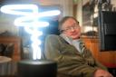 File photo dated 25/02/12 of Professor Stephen Hawking, who has died aged 76, posing beside a lamp titled 'black hole light' by inventor Mark Champkins, presented to him during his visit to the Science Museum in London. PRESS ASSOCIATION Photo. Is
