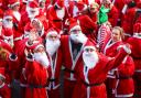 PHOTOS: Hundreds don red suits for Winchester's Santa Fun Run