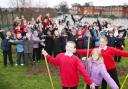 GROWING CONCERN: Pupils and teachers from Tanners Brook Junior School at the site of their proposed garden.   	Echo picture by Paul Collins. Order no: 10113232