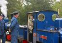 The Queen enjoys a ride on the narrow gauge railway at Exbury Gardens.
