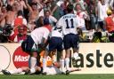 Paul Gascoigne is swamped by England teammates after scoring their second goal in the Euro 96 clash against Scotland, at Wembley..