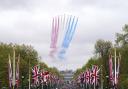 A general view of flypast by aircraft from the Red Arrows over the Mall following the coronation of King Charles III and Queen Camilla in London. Picture date: Saturday May 6, 2023. Photo: Niall Carson/PA