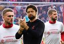 Saints manager Russell Martin and defenders Taylor Harwood-Bellis and Jack Stephens