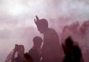 Southampton fans on top of the statue of former manager Ted Bates outside the stadium