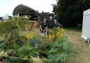 Rhianne, Liam and Simon standing behind their garden