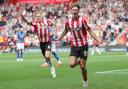 Flynn Downes celebrates with Tyler Dibling after his goal against Ipswich