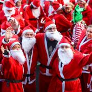 PHOTOS: Hundreds don red suits for Winchester's Santa Fun Run