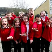 COURTING CASH: Pupils Beth Mayers and Hannah Summers, front left, with fellow youngsters at Shamblehurst Primary School.	 Echo picture by Joanna Mann. Order no: 10007712