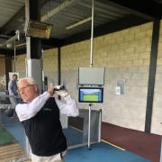Acting CEO of Artington Golf Limited Neil Baines taking the first shot with the new Toptracer technology at Hedge End Golf Centre.