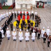 Crew from Queen Mary 2 mark the coronation
