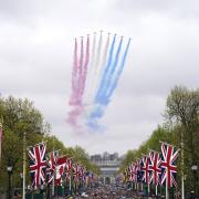 A general view of flypast by aircraft from the Red Arrows over the Mall following the coronation of King Charles III and Queen Camilla in London. Picture date: Saturday May 6, 2023. Photo: Niall Carson/PA
