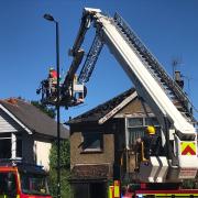 Fire crews making a house in Bitterne Road West safe after it was damaged by fire