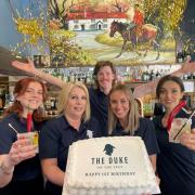 The Duke on The Test with staff with their first anniversary cake