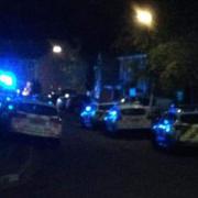 Emergency service vehicles in Goldcrest Gardens as officers and paramedics attended an incident near Tanner's Brook