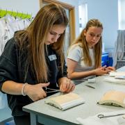 Year 9 students practice suturing. Picture: University of Southampton
