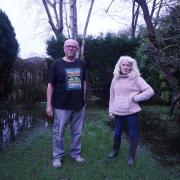 Felicity and Stephen Thompson from Eastleigh fear for their garden after it was submerged in 'four feet of water'