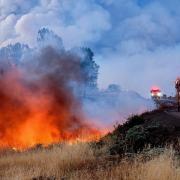 The Park Fire burns along Highway 32 in the Forest Ranch community of Butte County, California (Noah Berger/AP)