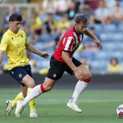 Oxford United’s Mark Harris and Southampton’s Charlie Taylor battle for the ball during the pre-season friendly match at the Kassam Stadium, Oxford.