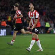 Yukinari Sugawara celebrates setting up Adam Armstrong's winning goal