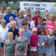 Katie Swan with Thornden Tennis Club chairman Matt Pitman and junior players