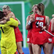 Alex Danson celebrates with Team GB teammates after the final whistle