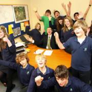 CELEBRATING: Head teacher Chris Willsher and pupils of Priestlands School after the school’s ‘outstanding’ Ofsted report.