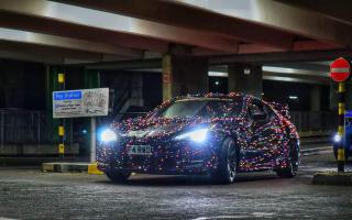 Ethan Day-Lewis' car covered in 3,000 Christmas lights.