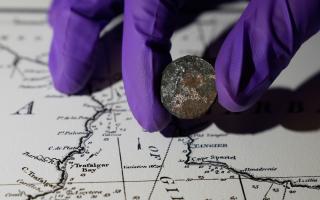 Conservation workers discovered a 127-year-old coin under the mast of the HMS Victory (Andrew Matthews/PA)
