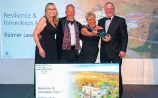 Hotel co-owners, Chris and Alison Wilson collecting their award at The Beautiful South Awards for Excellence 2022. Picture: Balmer Lawn Hotel & Spa