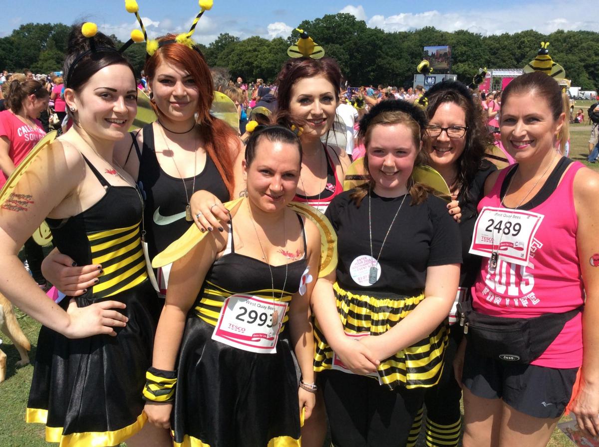 Queen Bee Ellen Davenport (centre) with her friends and colleagues from West Quay Ltd mail order company after Race For Life.