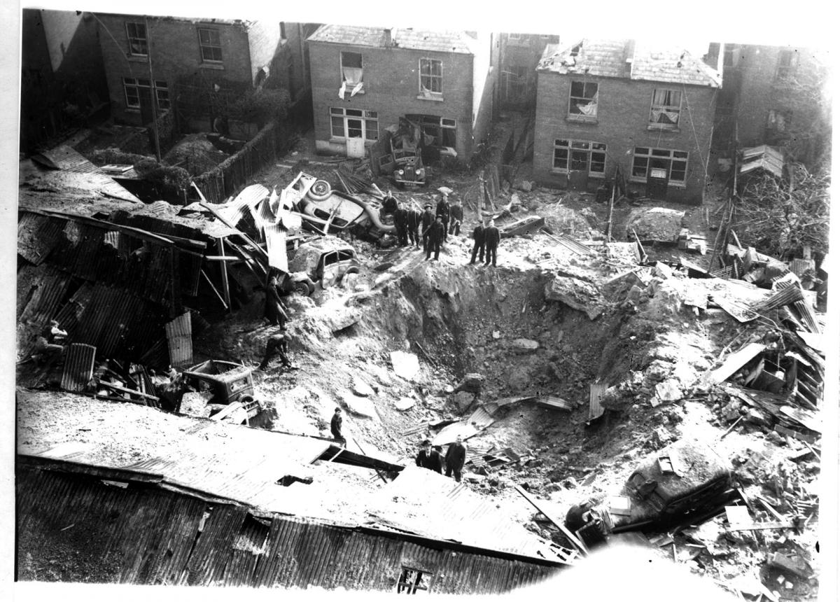 A massive bomb crater is left after a German bomb fell on Alec Bennetts in Portswood behind the Broadway Cinema