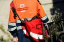 A Royal Mail postman on his rounds