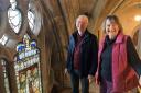 WORK: Howard Wells and Anne Eglington of the Friends of Malvern Priory at the Creation Window - although on the risk register much has been done to conserve the medieval glass