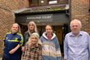 Kingsland Court residents standing outside the building.