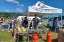 The Wave Project selling sweetcorn at the Garlic Festival 2023.