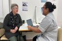Clare Tull seen during a clinic with Clinical Trials Assistant Mitzel Sapalo
