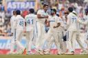 India’s Ravichandran Ashwin celebrates the wicket of England’s Joe Root (Ajit Solanki/AP)