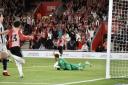 Adam Armstrong celebrates scoring against West Brom