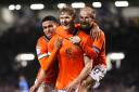 Sheffield Wednesday's Michael Smith (centre) celebrates with teammate Barry Bannan (right) and Shea Charles