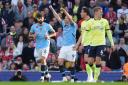 Manchester City's Erling Haaland (centre) celebrates scoring their side's first goal