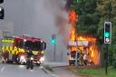 Road closed after van goes up in flames at busy roundabout