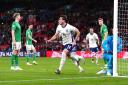 Taylor Harwood-Bellis (centre) celebrates scoring on his England debut