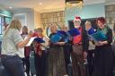 Winchester Community Choir treated residents to a festive singalong