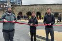 Councillor Eamonn Keogh cut the ribbon, held by representatives from Bluestar and the University of Southampton, as the new bus hub opened.