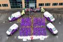 Cruden staff members with six tonnes of food supplies donated in 2024