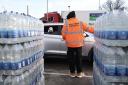 Long queues as people collect bottles of water at Places Leisure in Eastleigh.