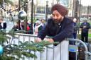 Nirmal Singh MBE places a bauble on the tree